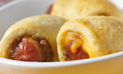 Add a twist to pigs-in-a-blanket with this coneys in a blanket recipe with Cincinnati-style chili. They'll be gone in minutes!