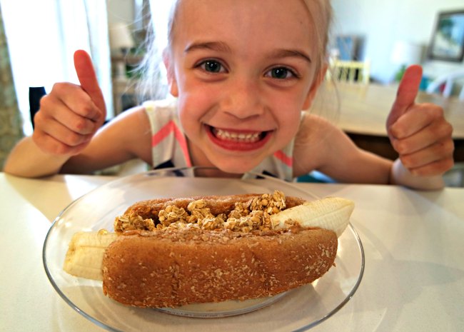 Looking for great breakfast, lunch and snack ideas that will keep your kids healthy and energized? You'll love these granola, peanut butter banana dogs. They're my daughter's favorite - and they're SO easy to make! Perfect lunch idea for kids!