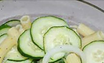 Whether you're feeding a crowd or just have a garden overflowing with cucumbers, this easy pasta salad is always a hit, and it's the perfect dish to bring to a cookout. It's crispy, cold, sweet and refreshing - just what you want during the summer heat. Cut the sugar in half to make it a healthy option.