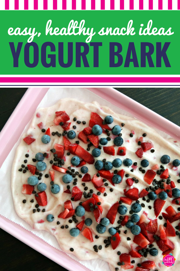 This healthy yogurt bark recipe is about to become your new favorite clean eating snack. But get ready to fight your kid on who gets the last bite! It could NOT be easier to make. In fact, the hardest part will be waiting for it to become frozen. You can use any yogurt flavor you want (even chocolate!) and any fruit combination you can think of - we used strawberries and blueberries + chocolate chips. YUM! See the full recipe and video here. #yogurt #snack #cleaneating #recipe #easy #chocolate #kids #fruit #yum