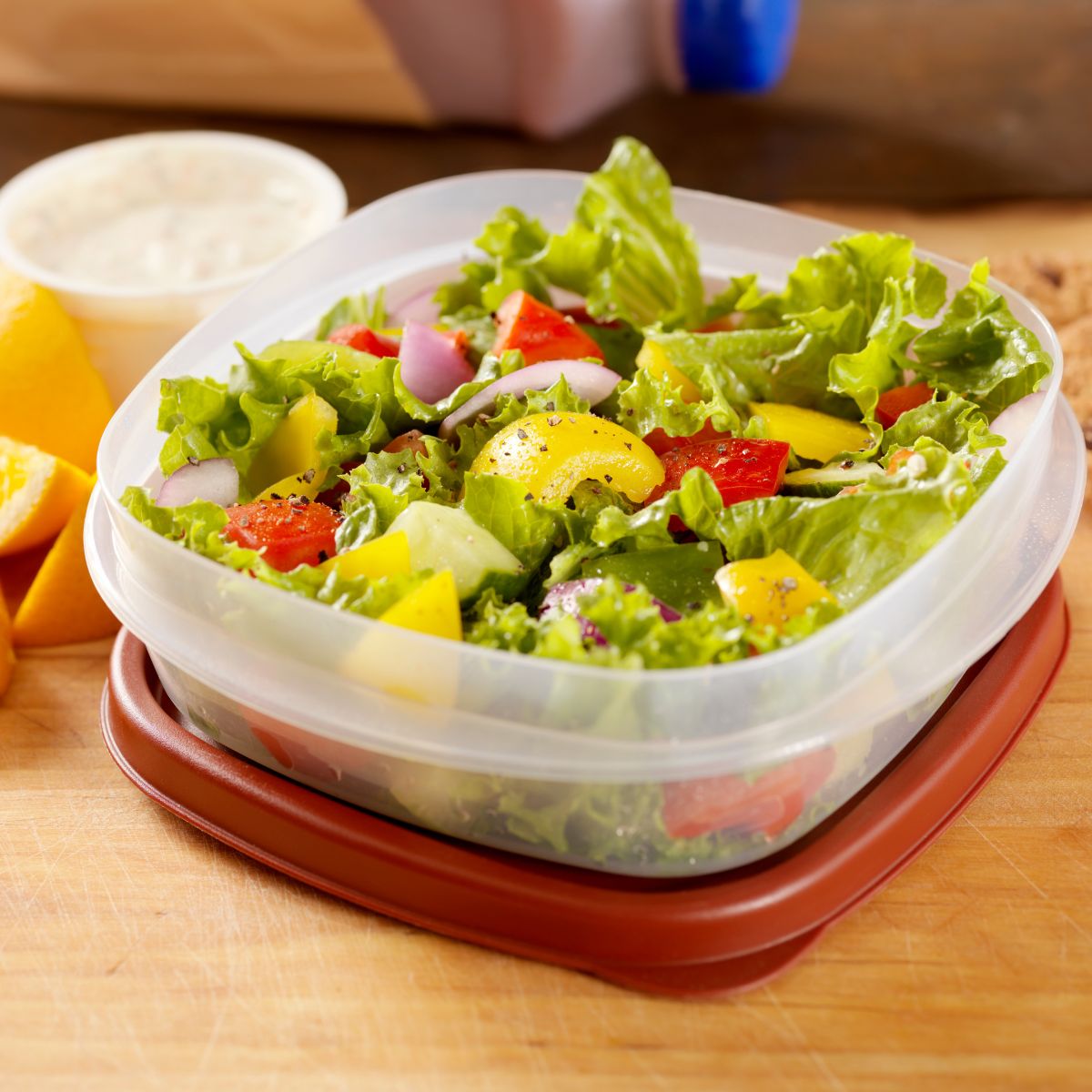 Crisp salad in plastic tupperware. Packed lunch.