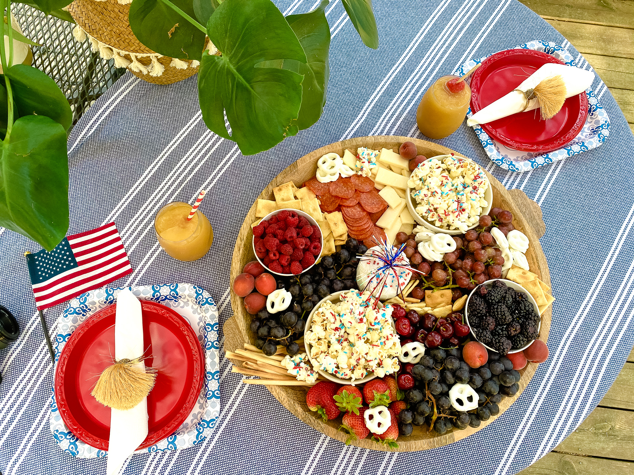 Top down view of 4th of July charcuterie board featuring red, white and blue foods.