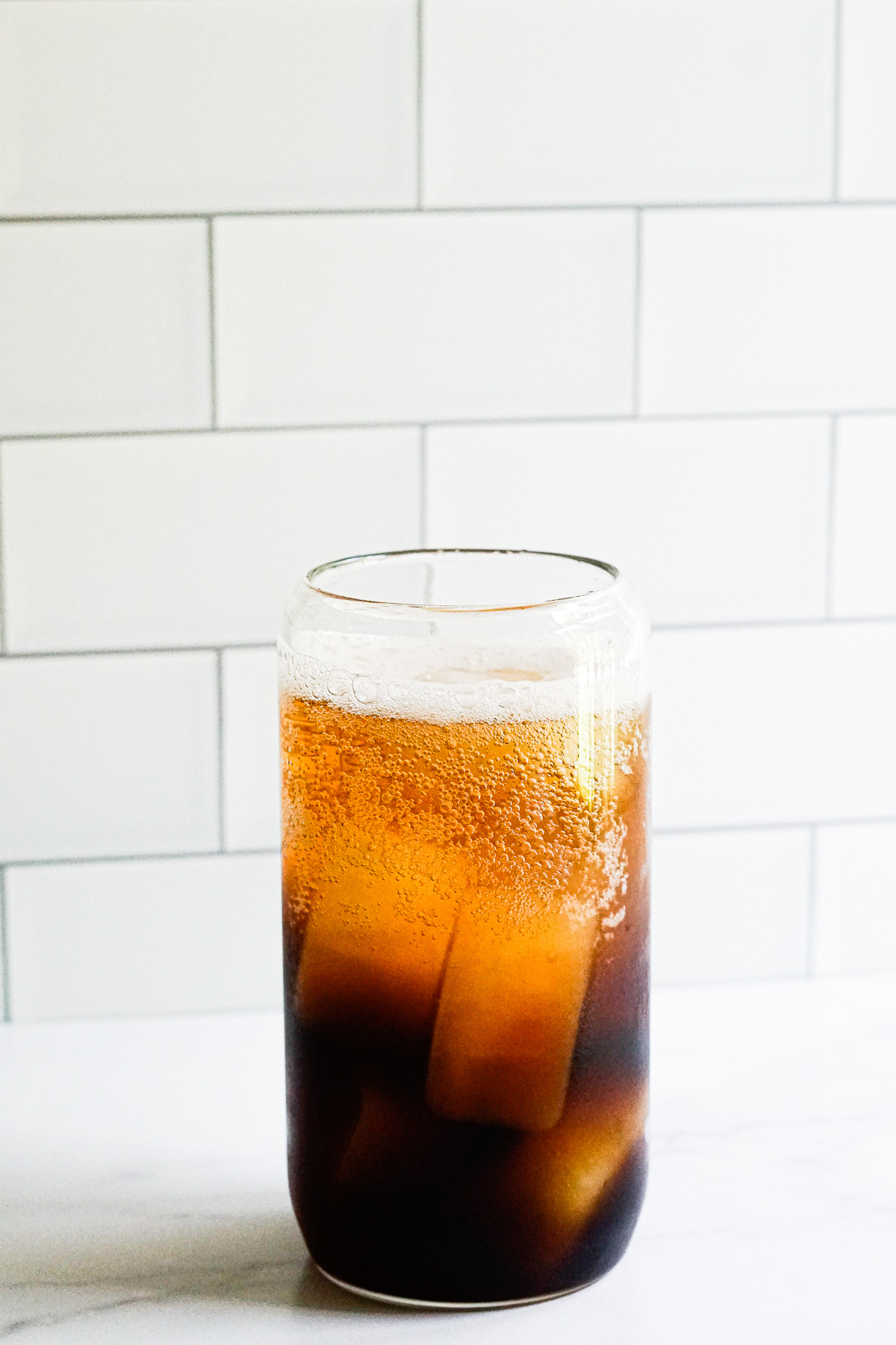 Coffee Soda in a clear glass.