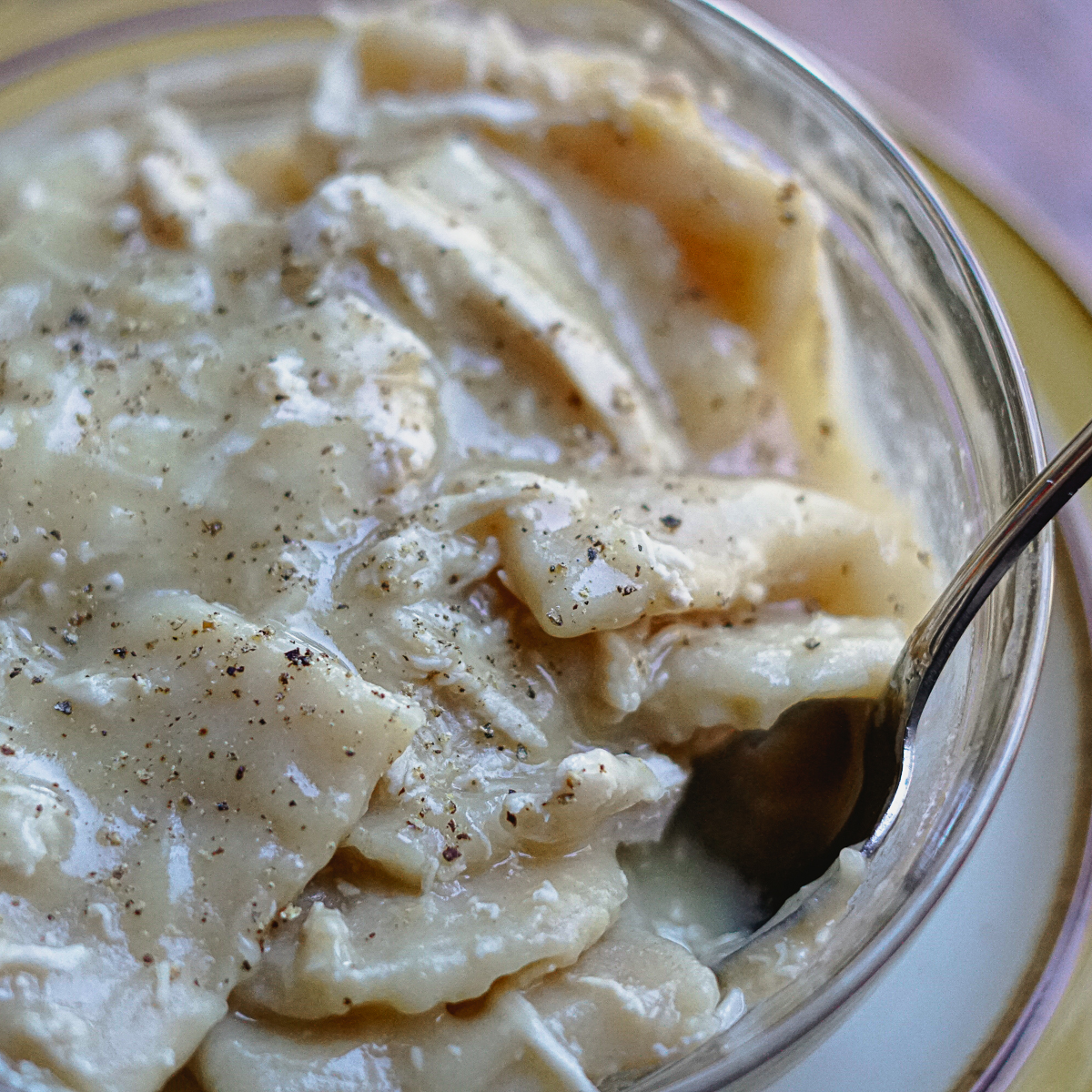 Dairy free chicken and dumplings in a glass bowl