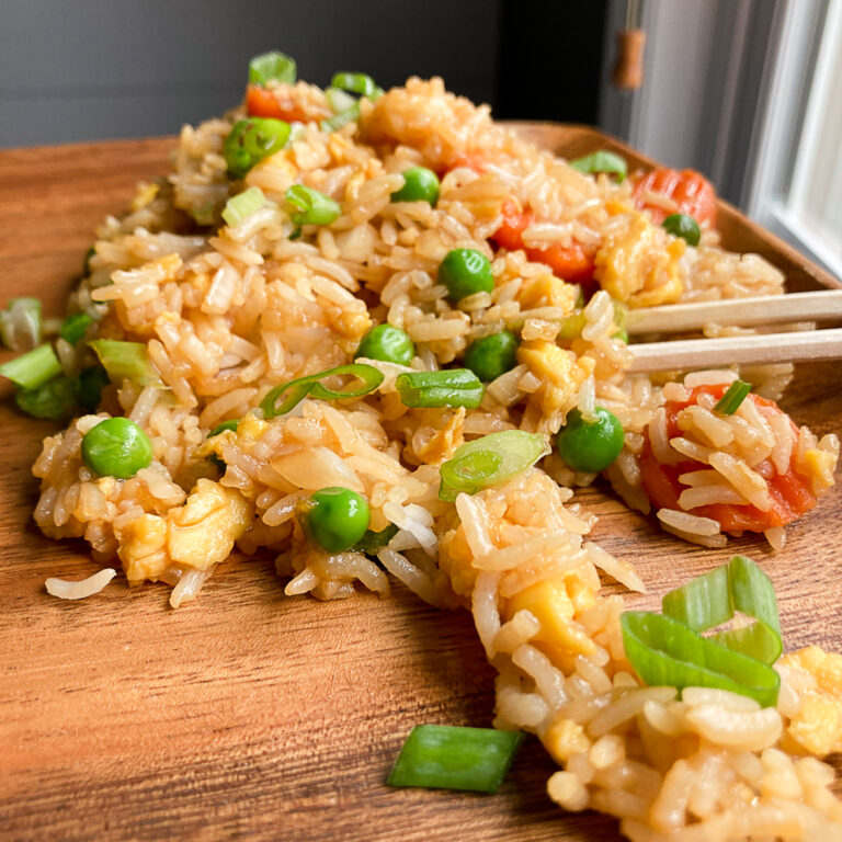 Fried rice recipe on a brown plate and with chopsticks