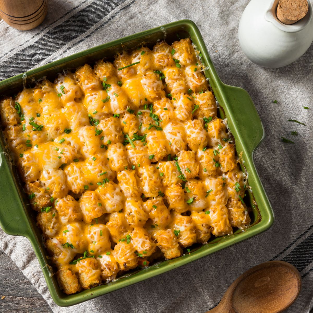 Cheesy Chicken Bacon Ranch Tater Tot casserole made as a freezer casserole in a green square casserole dish