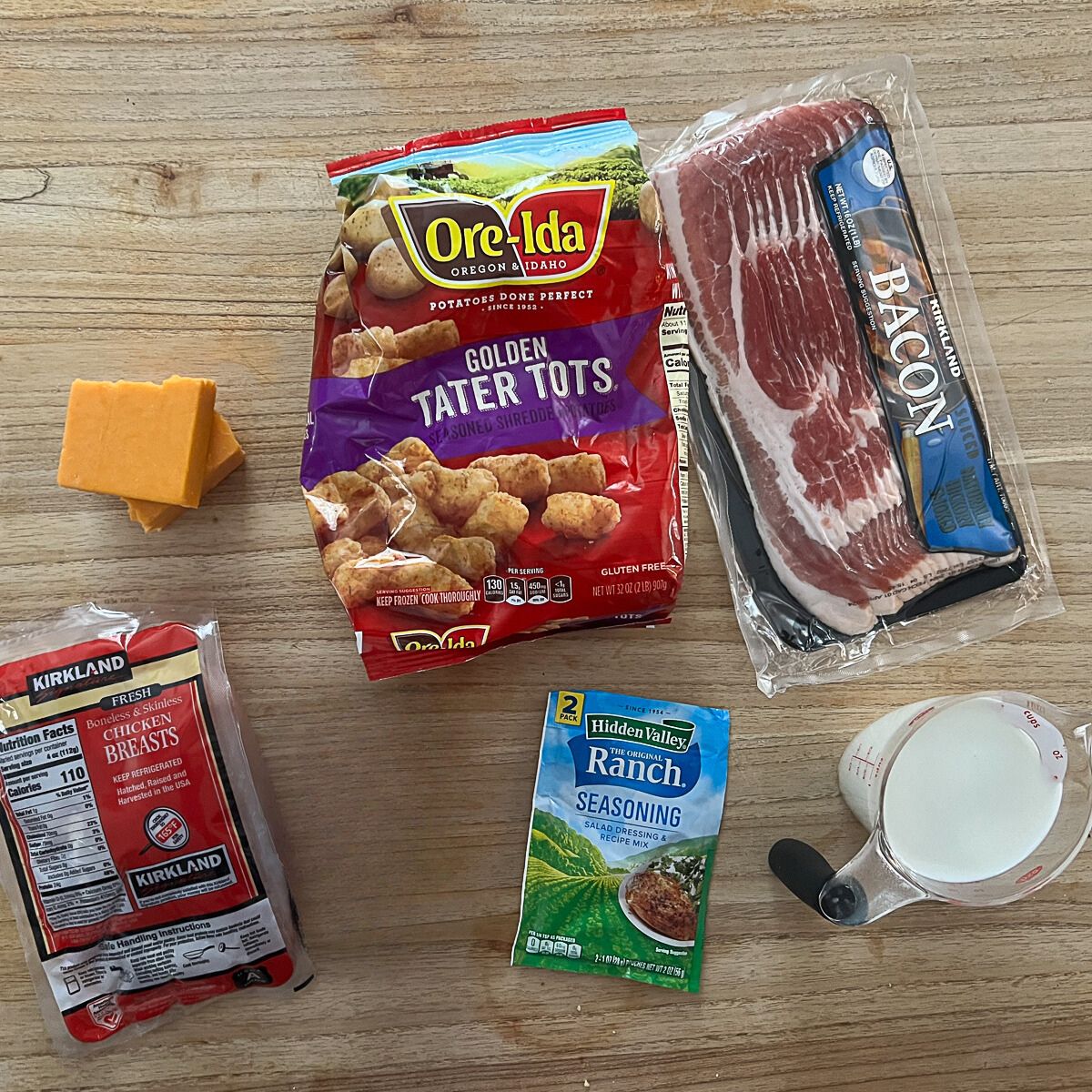 Ingredients for Chicken Bacon Ranch Tatertot Casserole - chicken, ranch seasoning, milk, cheddar cheese, Tater Tots, Bacon.