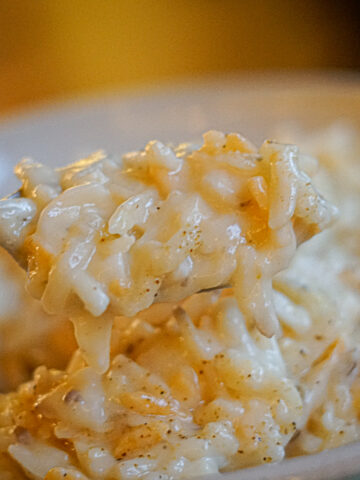 Cracker Barrel Copycat Dairy Free Cheesy Potatoes with a fork taking a creamy bite
