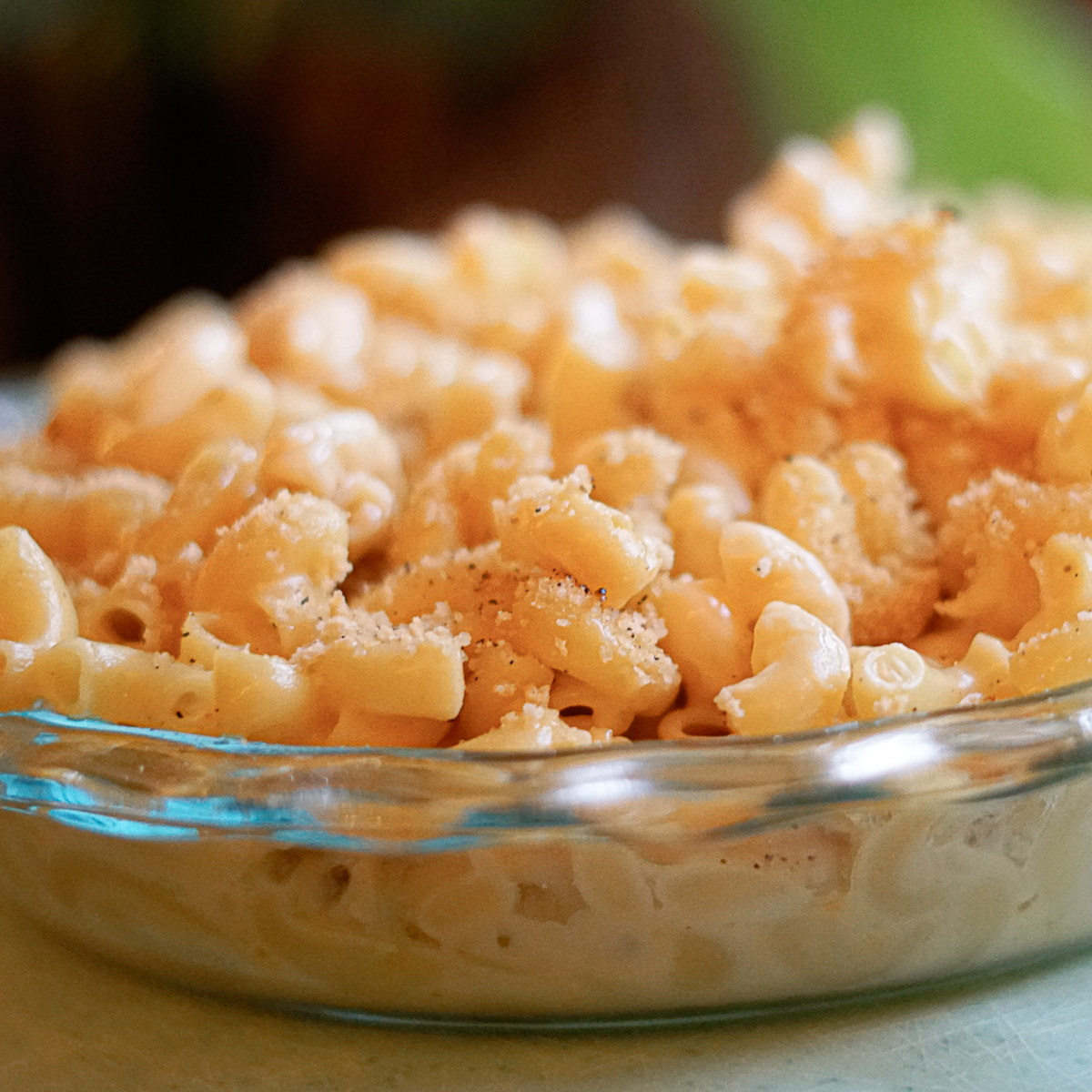 Dairy Free Cracker Barrel Macaroni and Cheese in a glass dish, seasoned with black pepper