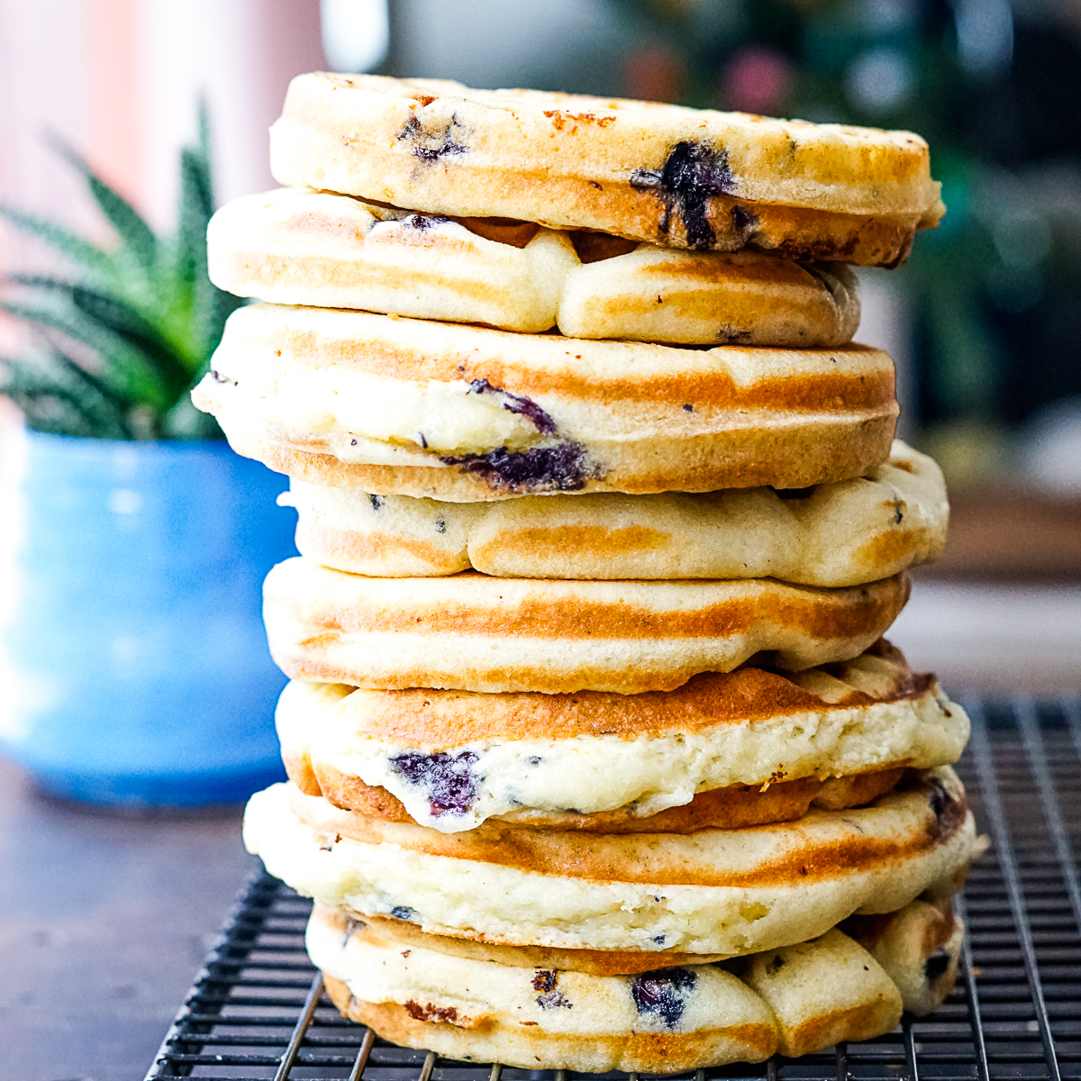 Large stack of blueberry muffin waffles